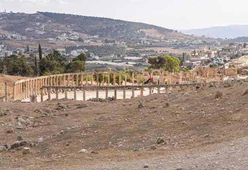 Oval Plaza and entrance wheile walking between monuments in Jerash, a Greco-Roman well preserved city in Jordan