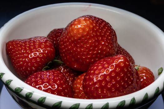 Wild strawberry with ripe fruit in close up