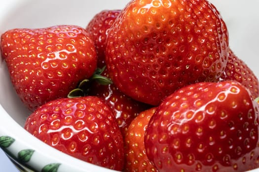 Wild strawberry with ripe fruit in close up