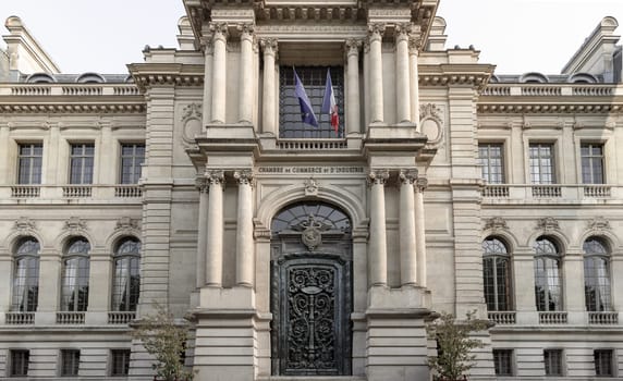 France, Paris - May 03, 2025 - Architectural exterior splendor of The Paris Chamber of Commerce and Industry building (Chambre de commerce de Paris) is a French chamber of commerce that supports businesses in Paris and the ile-de-France region. It located at Friedland avenu, use it as your Wallpaper, Poster and Space for text, Selective focus.