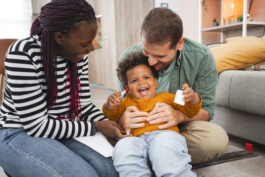A happy family engages in playful activities at home, creating joyful memories.