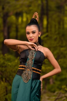 The fierce face of an Indonesian woman wearing makeup on her face and a black costume after a dance performance at the festival