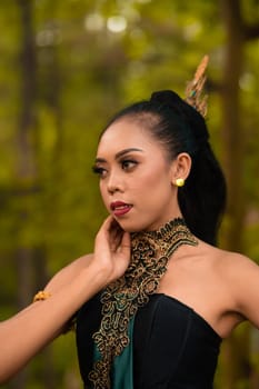 Balinese Woman wearing makeup with red lips while feeling sexy while wearing golden jewelry around her neck during the photo shoot