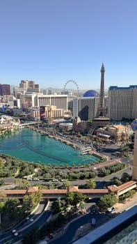 Las Vegas, NV USA - September 03, 2025: A breathtaking aerial perspective of the Las Vegas Strip showcasing the Eiffel Tower replica, waters of the Bellagio fountains, and the High Roller observation wheel.