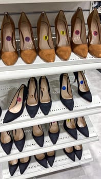 Ottawa, Canada - March 02, 2025: A collection of stylish high-heeled shoes arranged on a retail shelf, showcasing a variety of colors and sizes, perfect for fashion women looking for elegant footwear
