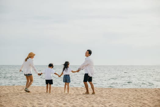 A delightful beach moment parents holding hands running and jumping with their children in holiday merriment. Capturing essence of family travel and carefree beach vacation bliss. tourism day concept