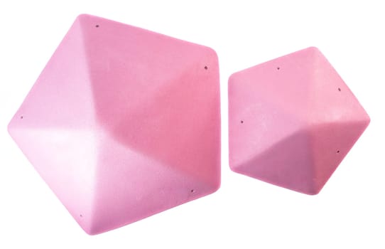 Set of pink triangular climbing volumes isolated on white background. Geometric holds for bouldering or gym training. Online store concept