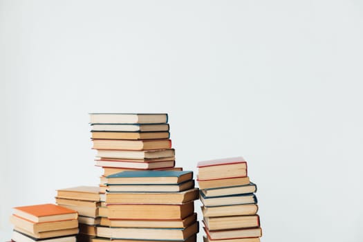 Stacks of books for teaching in the library on a white background