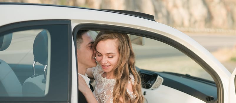 Couple shares tender moment in parked car during sunset. Love, connection, intimacy and peaceful joy captured in a candid romantic embrace.