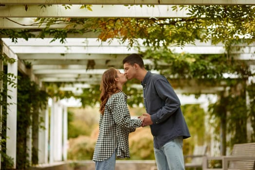 Young Cute Female Hugs Boyfriend. In Autumn Outdoor. Lovers Walking in Park. Attractive Funny Couple. Lovestory in Forest. Man and Woman. Cute Lovers in the Park. Family Concept. Happy Couple.
