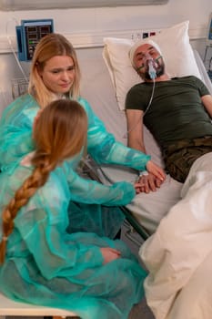 A loving family gathers in a hospital room, demonstrating their unwavering support for a cherished loved one in need