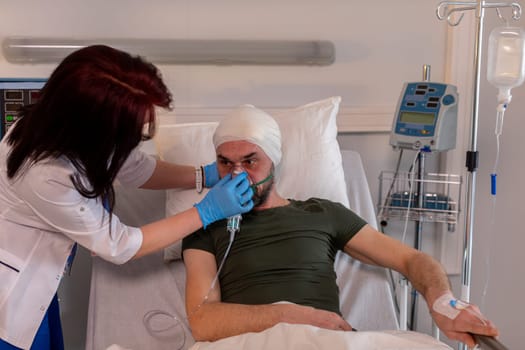 A nurse provides assistance to a patient who has sustained a facial injury while in a hospital setting