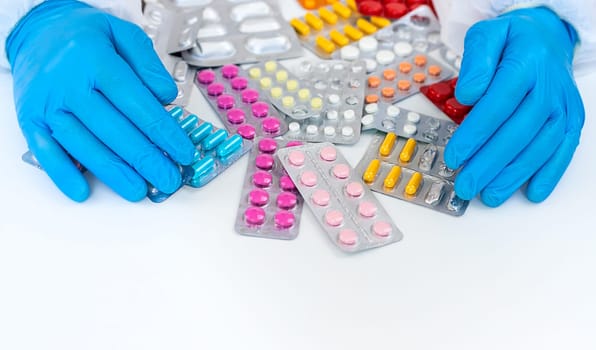 medicines in the hands of a doctor. Selective focus. pills.