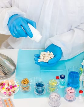 examine drugs in the laboratory. Selective focus. pills.