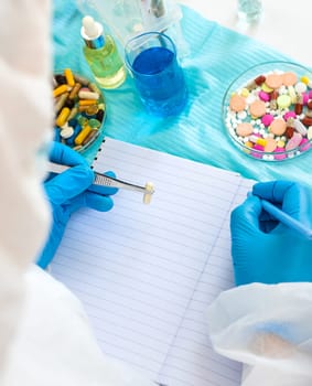 examine drugs in the laboratory. Selective focus. pills.