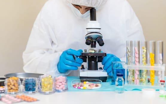 examine drugs in the laboratory. Selective focus. pills.