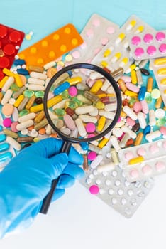 examine drugs in the laboratory. Selective focus. pills.