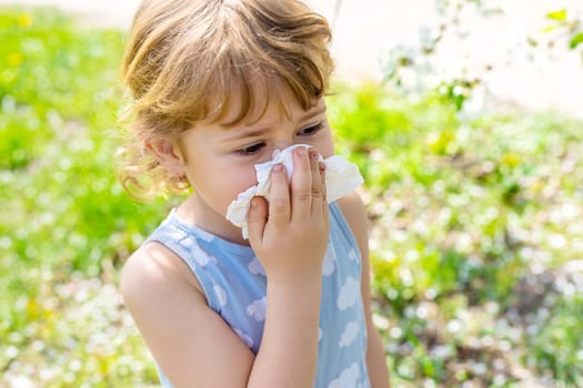 child allergic to flowering trees. Selective focus. kid.