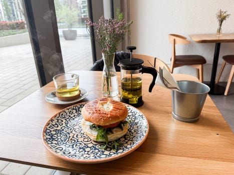 Bagel with sesame bun and arugula. Cafe breakfast culture, natural flavors and urban dining experiences.