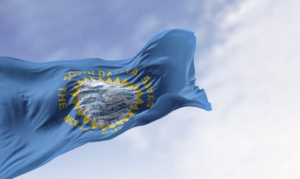 Close-up of the South Dakota flag with state seal fluttering in the wind, featuring sun rays symbolizing pride, freedom, and identity. Realistic 3D render of textured fabric