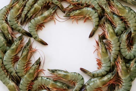 AI generated top view of fresh whole black tiger prawns with glossy shells and vibrant color arranged neatly showcasing natural beauty against clean white background