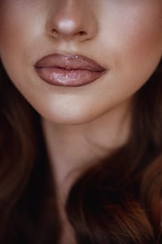 Close-Up of Woman with Glossy Lips and Radiant Skin - Natural Beauty and Minimalistic Makeup Concept.