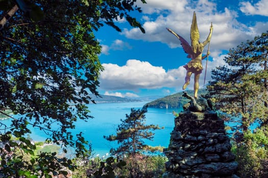 the statue of Saint Michael located above Lake Annecy