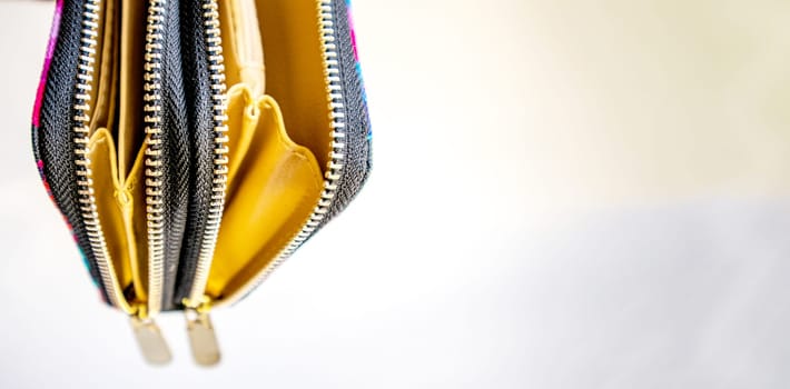 Fashionable outdoor women's empty purse, on a white background, copy space to the right.