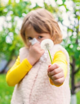The child is allergic to dandelions. Selective focus. Kid.