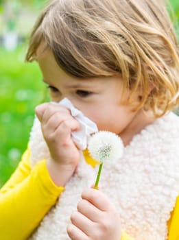 The child is allergic to dandelions. Selective focus. Kid.