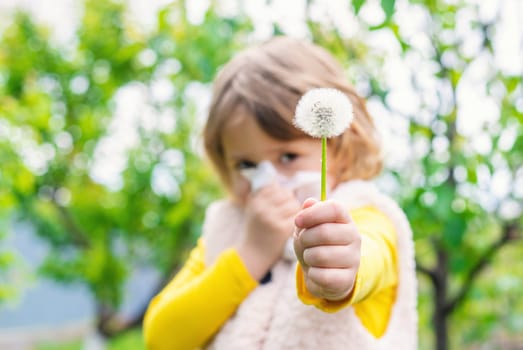 The child is allergic to dandelions. Selective focus. Kid.