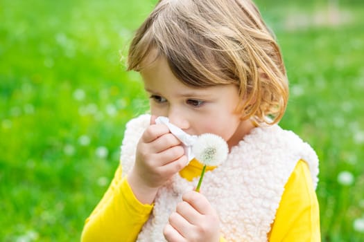 The child is allergic to dandelions. Selective focus. Kid.