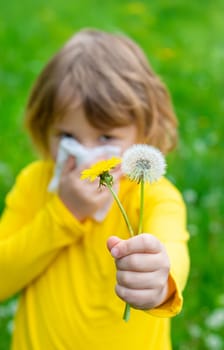 The child is allergic to dandelions. Selective focus. Kid.