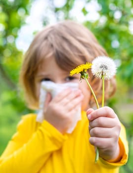 The child is allergic to dandelions. Selective focus. Kid.