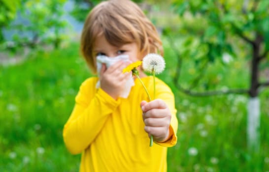 The child is allergic to dandelions. Selective focus. Kid.