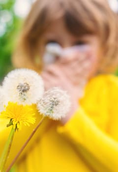 The child is allergic to dandelions. Selective focus. Kid.