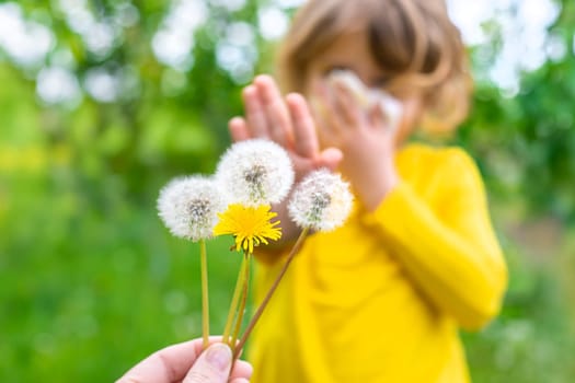 The child is allergic to dandelions. Selective focus. Kid.