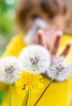 The child is allergic to dandelions. Selective focus. Kid.