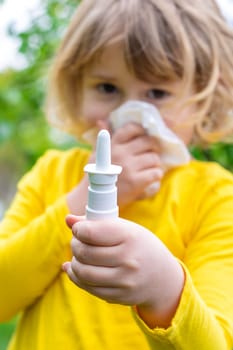 The child is allergic to dandelions. Selective focus. Kid.