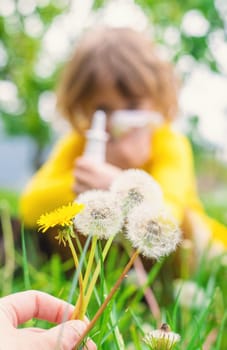 The child is allergic to dandelions. Selective focus. Kid.