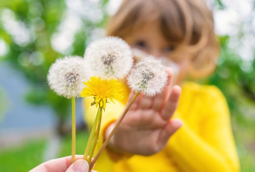 The child is allergic to dandelions. Selective focus. Kid.