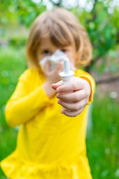 The child is allergic to dandelions. Selective focus. Kid.