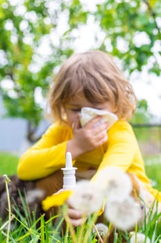 The child is allergic to dandelions. Selective focus. Kid.