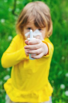 The child is allergic to dandelions. Selective focus. Kid.