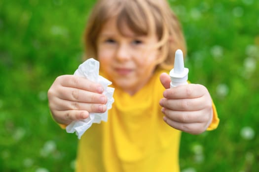 The child is allergic to dandelions. Selective focus. Kid.