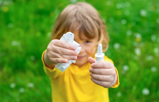 The child is allergic to dandelions. Selective focus. Kid.