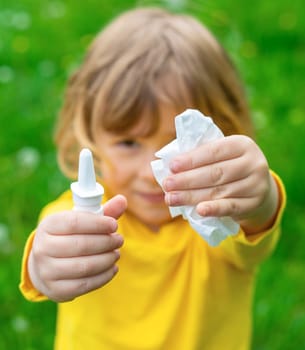 The child is allergic to dandelions. Selective focus. Kid.