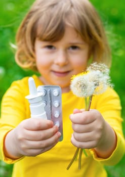 The child is allergic to dandelions. Selective focus. Kid.