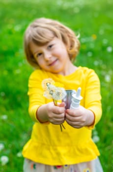 The child is allergic to dandelions. Selective focus. Kid.