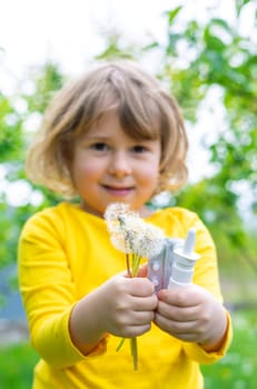 The child is allergic to dandelions. Selective focus. Kid.